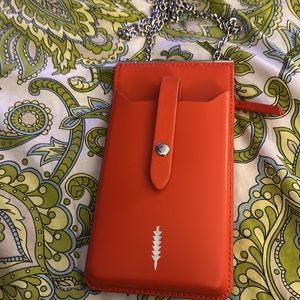 Thacker Nora phone crossbody. . Color: chili/ shiny nickel chain strap.